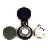 A cased pocket barometer, a gold plated pocket watch and a hammered pewter box.