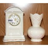 A Belleek porcelain clock and vase, clock H. 20cm.