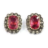 A boxed pair of yellow and white metal earrings set with faceted cut pink tourmalines and