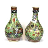 A pair of 19th century hand painted porcelain vases, H. 22cm.