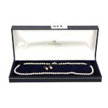 A vintage Japanese single row cultured pearl necklace on a 925 silver clasp with a pair of 14ct gold