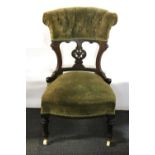 A Victorian mahogany nursing chair.