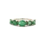 A 925 silver oval cut emerald set half eternity ring, (N.5).