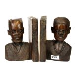A pair of African carved hardwood book ends, H. 20cm.