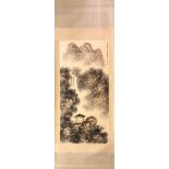 A Chinese silk mounted scroll painting of a pagoda in a waterfall landscape, 81 x 229cm.