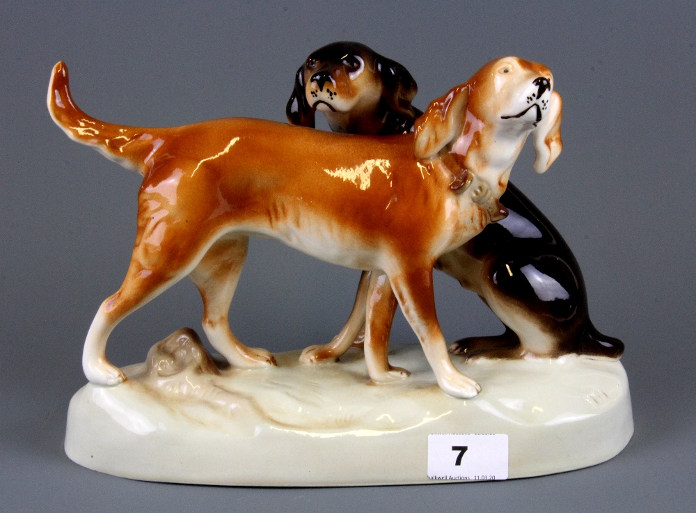 A Royal Dux porcelain figure of two dogs, H. 20cm.