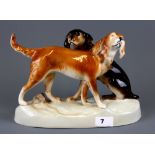 A Royal Dux porcelain figure of two dogs, H. 20cm.