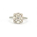 A white metal (tested high carat gold) ring set with brilliant cut diamonds, approx. 0.70ct overall,