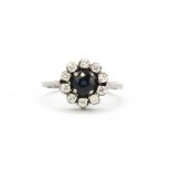 A white metal (tested minimum 9ct gold) sapphire and diamond cluster ring, Dia. 1.1cm, (H).