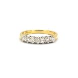 An 18ct yellow and white gold ring set with seven brilliant cut diamonds, approx. 0.50ct overall, (
