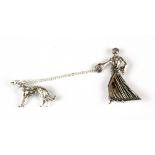 An Art Deco style 925 silver and marcasite brooch of a woman walking a dog, H. 5cm.