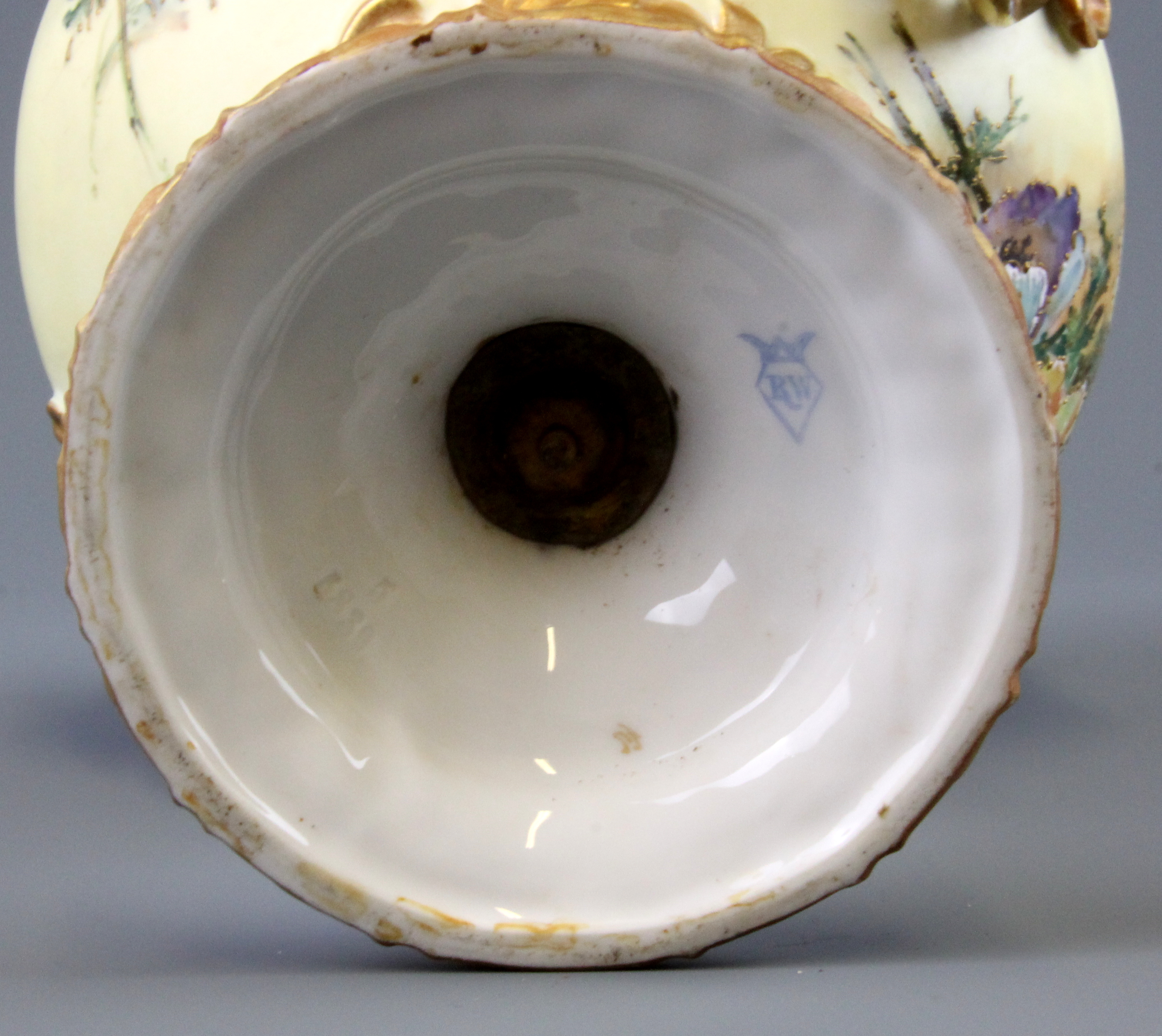 A 19th Century hand painted Continental porcelain urn and lid with green man handles, H. 30cm. - Image 3 of 3