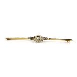 A yellow and white metal (tested 18ct gold) bar brooch set with a pearl and rose cut diamonds, L.
