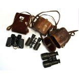 Three pairs of binoculars, one by Voigtlander and another Siebert.