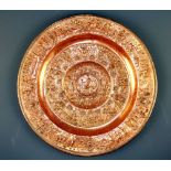 A 19th Century hammered copper wall plate stamped Tanpe Rantia, Dia. 39cm.