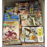 A very large quantity of vintage war comics.