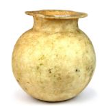 Antiquities interest. An early polished alabaster vessel, H. 22cm.