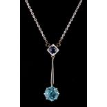 A 14ct white gold necklace (stamped 585) set with a sapphire and natural blue zircon, L. 2.6cm.