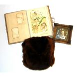 A Victorian leather photograph album, a fur muff and a Smith alarm clock.