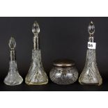 A group of four silver mounted cut glass dressing table items.