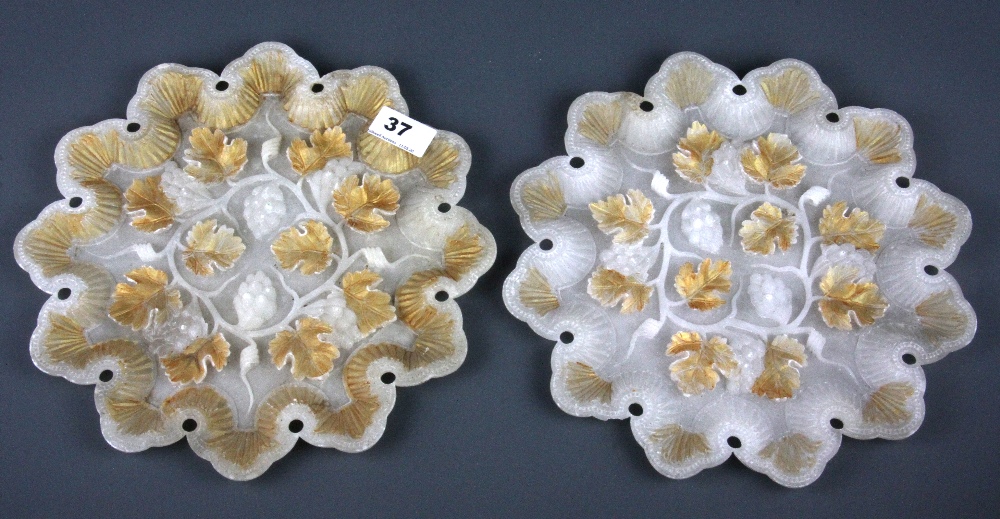 A pair of 19th Century carved and gilt alabaster plates, Dia. 28cm.