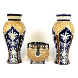 A pair of Doulton Lambeth stoneware vases, H. 28cm, (one with repair to rim) together with a similar