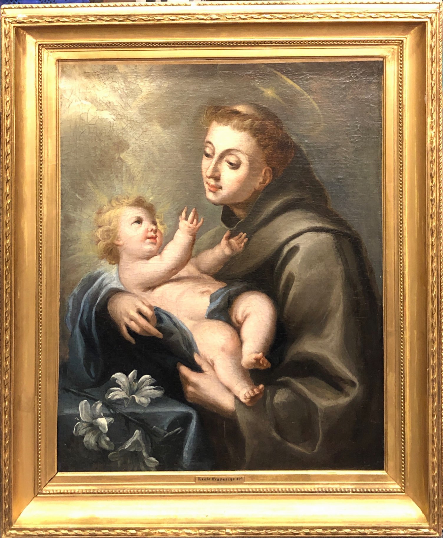 A 17th/18th Century French gilt framed oil on canvas of Saint Anthony with the child Jesus, 75 x