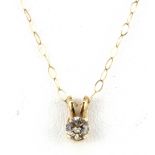 A 9ct yellow gold (stamped 375) diamond set pendant and chain, approx. 0.25ct.