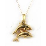 A 9ct yellow gold dolphin shaped pendant and chain, L. 2cm.