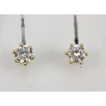 A pair of 18ct yellow gold brilliant cut diamond set stud earrings, approx. 0.66ct overall.