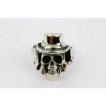 A 925 silver skull shaped ring, (U).