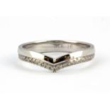 A 9ct white gold diamond set wishbone ring, (N).