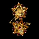 A 925 silver gilt ring set with pear cut orange sapphires and rodolite garnets, (Q.5).