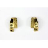 A pair of 9ct yellow gold stud earrings, L. 1.2cm.