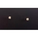 A pair of 9ct yellow gold stud earrings set with brilliant cut diamonds, approx. 0.30ct.