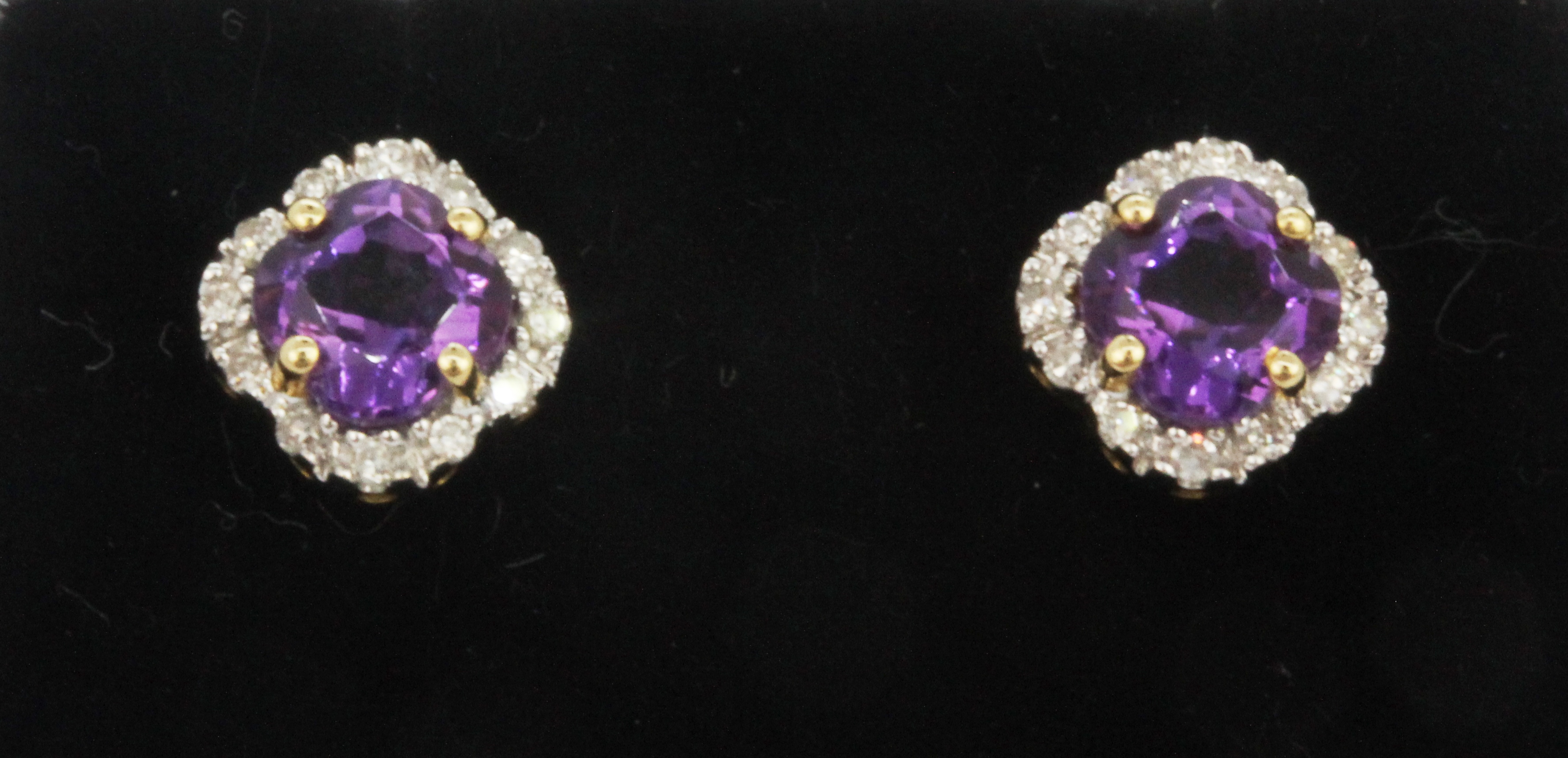 A pair of 18ct yellow gold stud earrings set with amethyst and diamonds, L. 0.6cm.