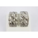 A pair of 18ct white gold (stamped 18k) diamond set earrings, L. 2cm.