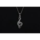 A 925 silver Sol key shaped pendant and chain set with white stones, L. 3cm.