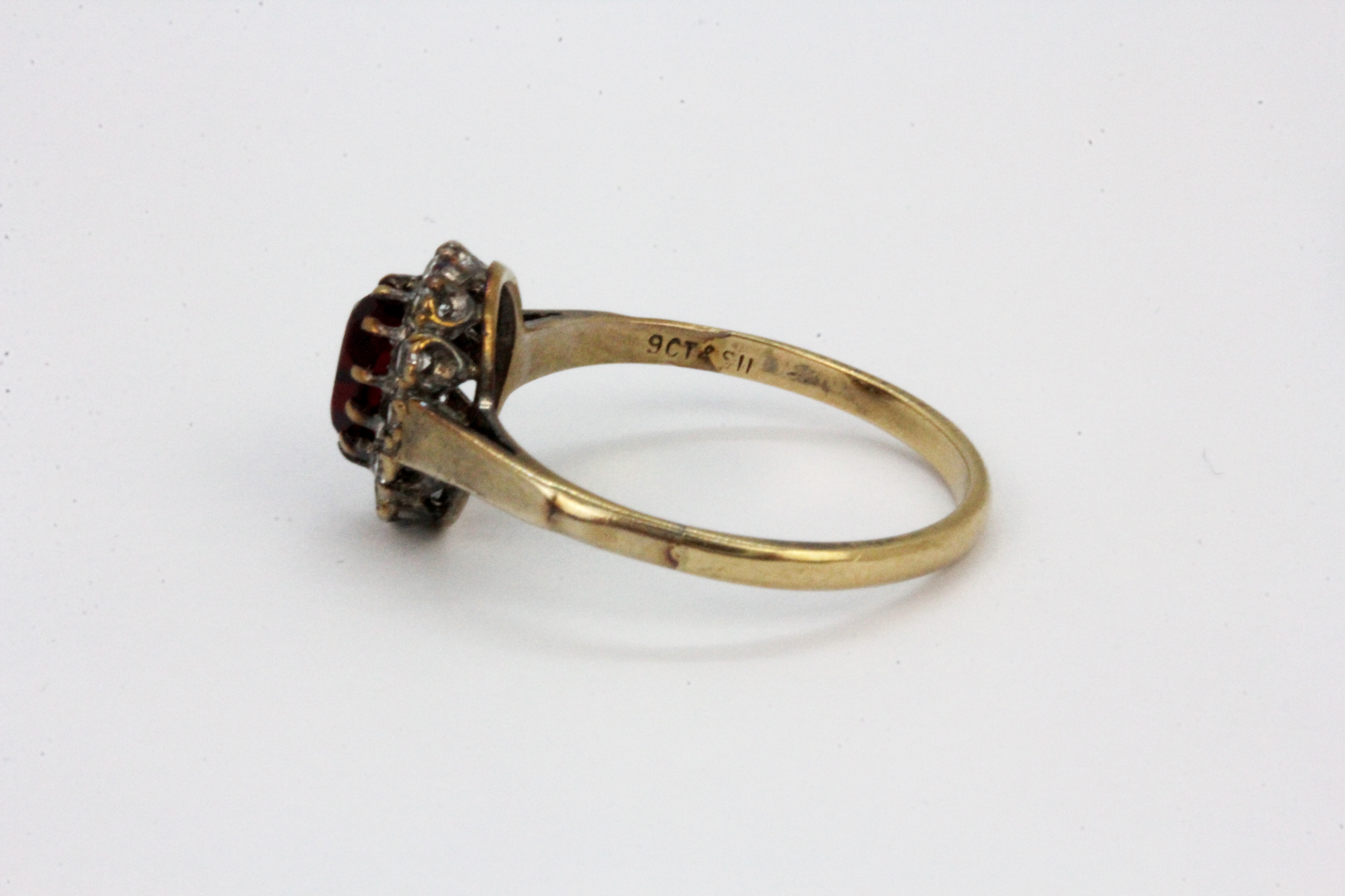 A 9ct yellow gold and silver stone set cluster ring, (S.5). - Image 2 of 2