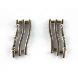 A pair of 18ct white gold diamond set wave earrings, L. 1.6cm.