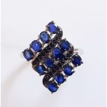 A 925 silver ring set with oval cut kyanite and black spinel, (Q).