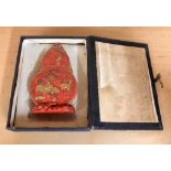 A boxed gilt decorated Chinese calligraphers red presentation ink block, H. 12cm. Condition -