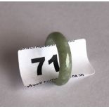 A fine pale celadon green jadeite jade wedding style ring. Band width 0.6cms internal dia. 1.8cms.