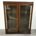 A glazed oak cabinet, size 93 x 115cm.