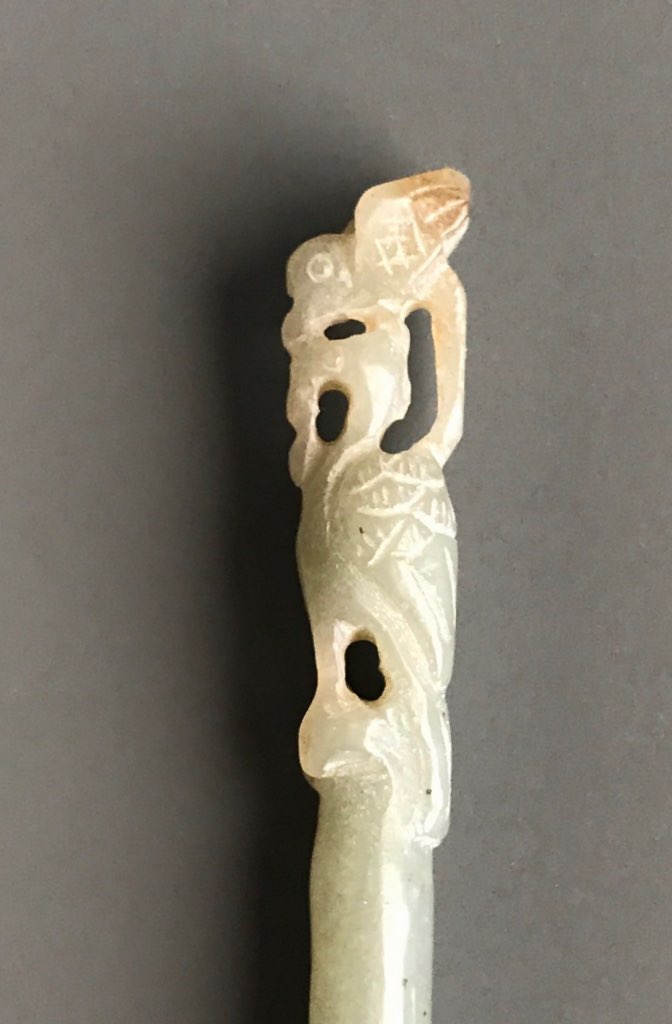 A 19th/early 20thC Chinese carved nephrite jade hair pin with top decoration of a small bird sitting - Image 2 of 2