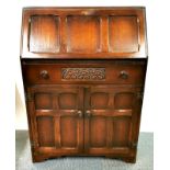 An oak veneered bureau, 76 x 45 x 107cm.