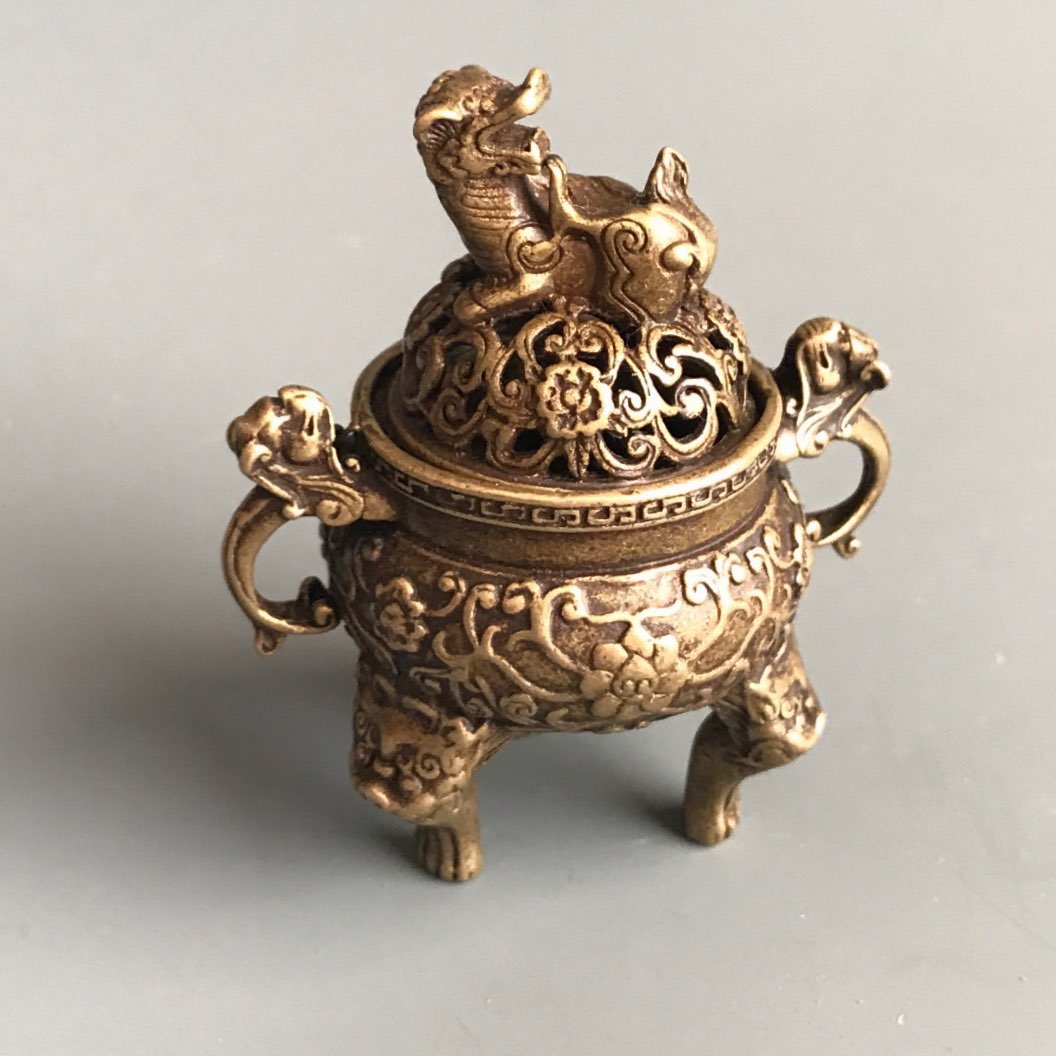 An early 20th Century Chinese polished bronze/brass censer with elephant head handles, H. 30cm. - Image 2 of 3
