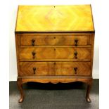 A walnut quarter veneered bureau, 75 x 45 x 100cm.