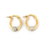 A pair of 925 yellow and white gold hoop earrings, L. 1.6cm.