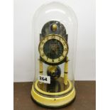 A vintage moon phase torsion pendulum clock with plastic dome, overall H. 29cm. Condition - Good,